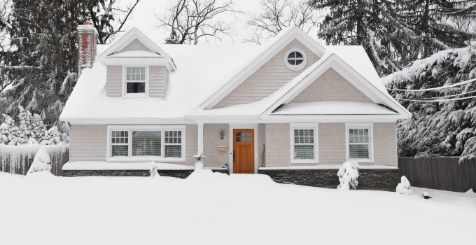 Outside of a house covered with snow.