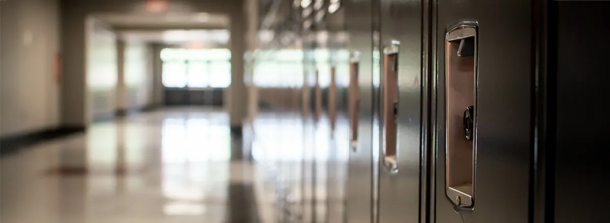 School campus hallway, empty with a closeup on lockers