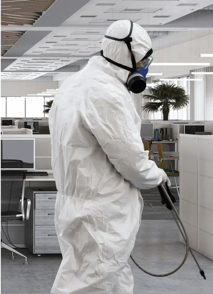 pest control technician treating the interior of an office building